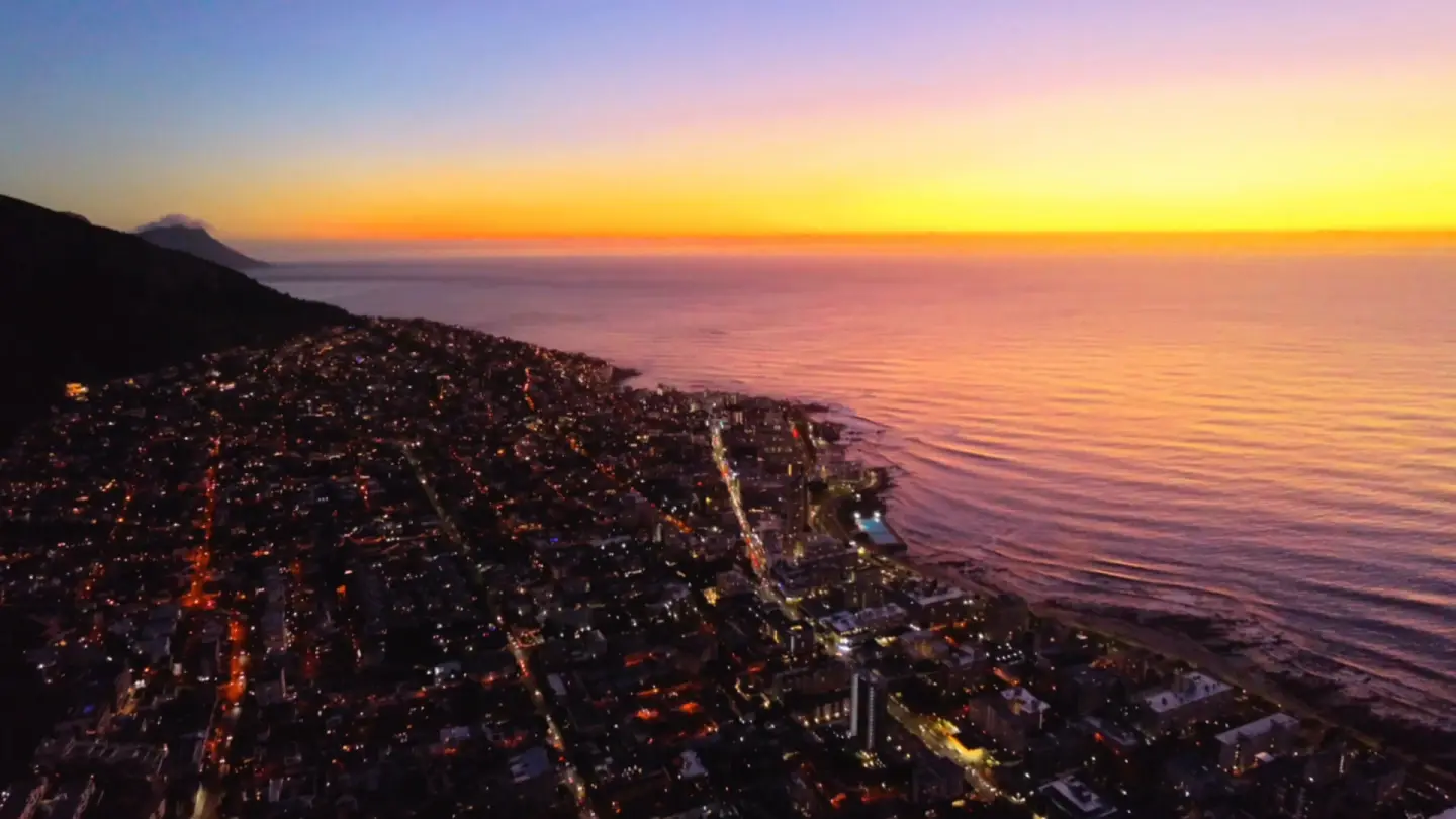 Sunset city coastline from the air